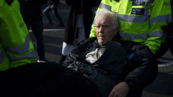 Extinction Rebellion protester climbs on plane at London City Airport
Extinction Rebellion protester climbs on plane at London City Airport