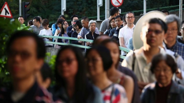 Hong Kong: Record turnout in elections seen as poll on pro-democracy protests
Hong Kong: Record turnout in elections seen as poll on pro-democracy protests